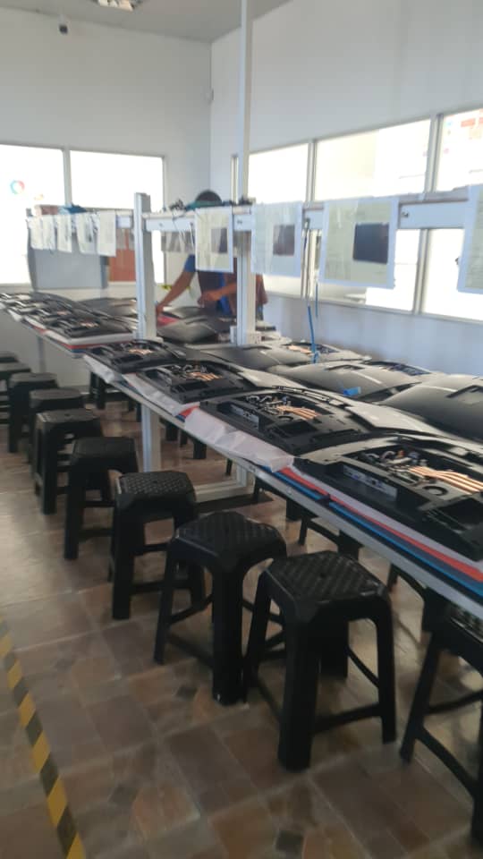 Manufacturing floor with workers assembling ICON products